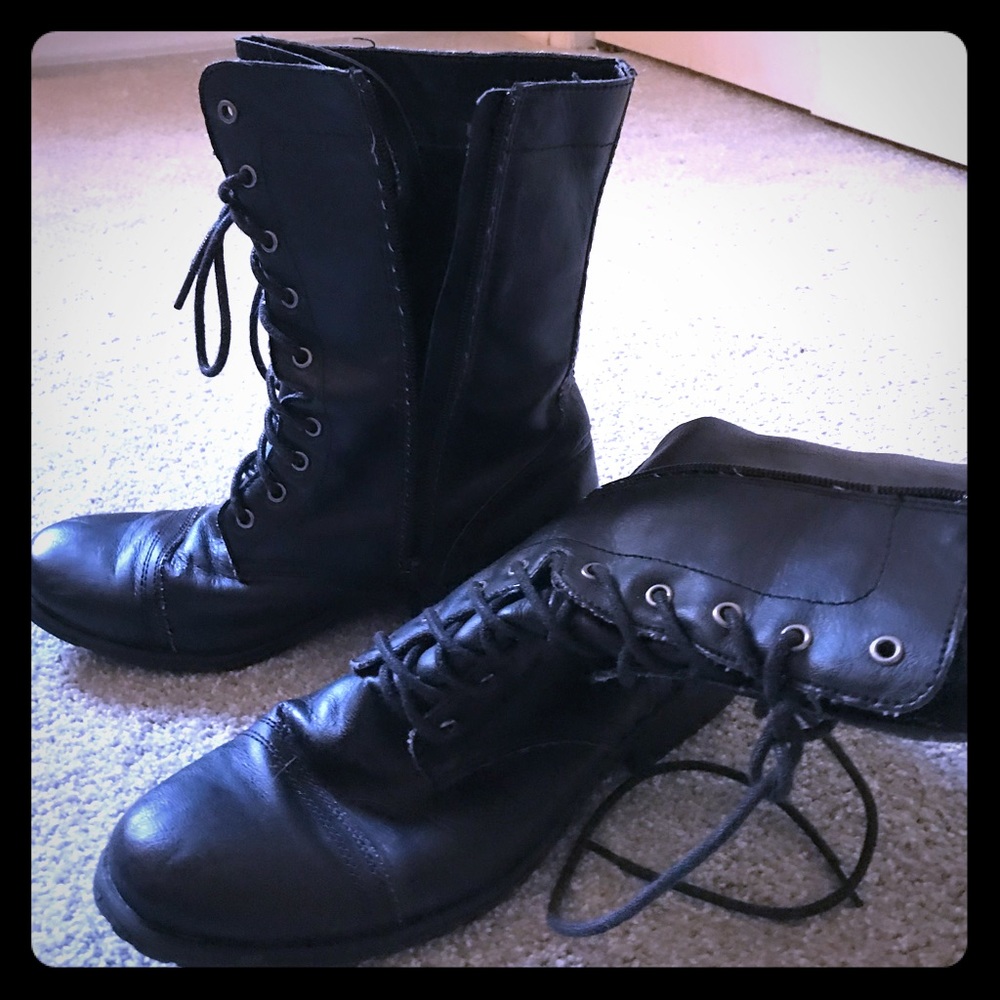 Zippered black boots with laces